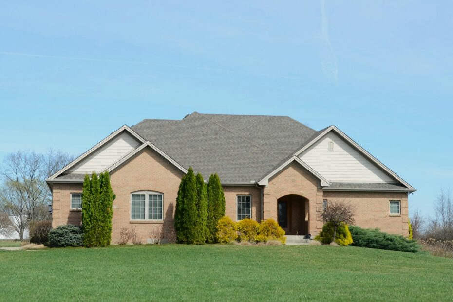 Single-story brick ranch home with a well-kept lawn